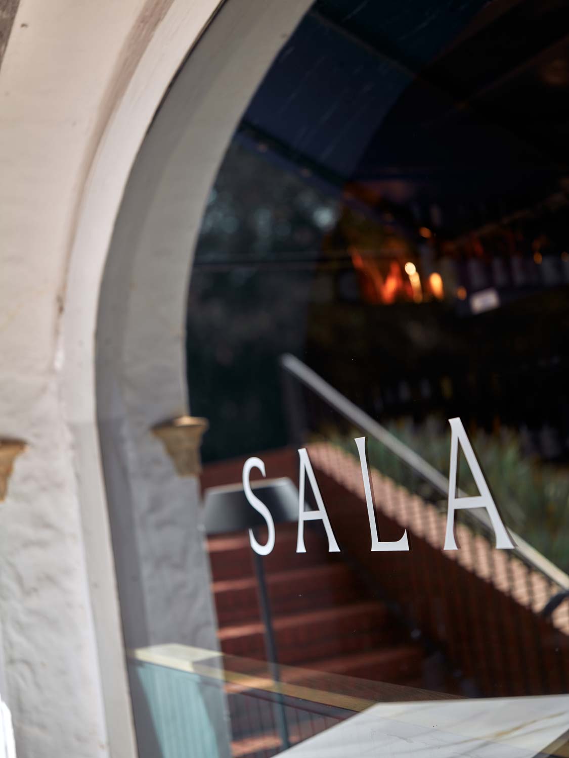 close up shot of sala logo decal on restaurant window